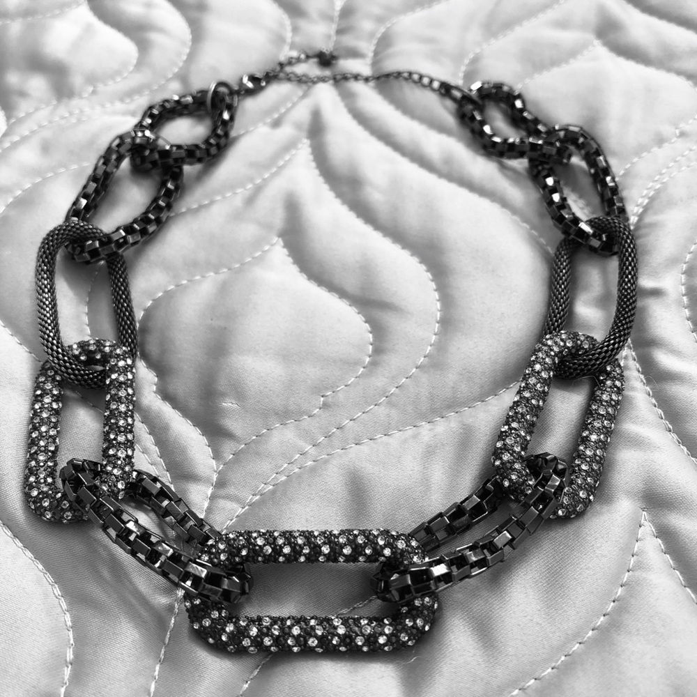 Black chain necklace with inset rhinestones.